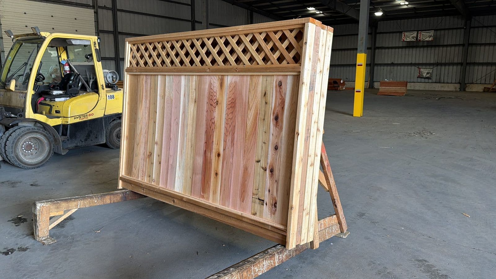 Cedar diagonal-lattice fence panels banded and staged at the NorthStar facility in Bolton, Ontario