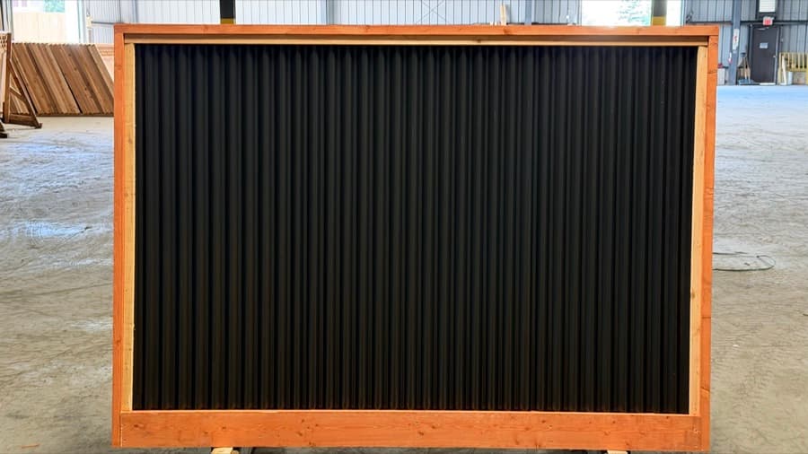 Wood and steel fence panel — black corrugated metal in a pre-stained frame