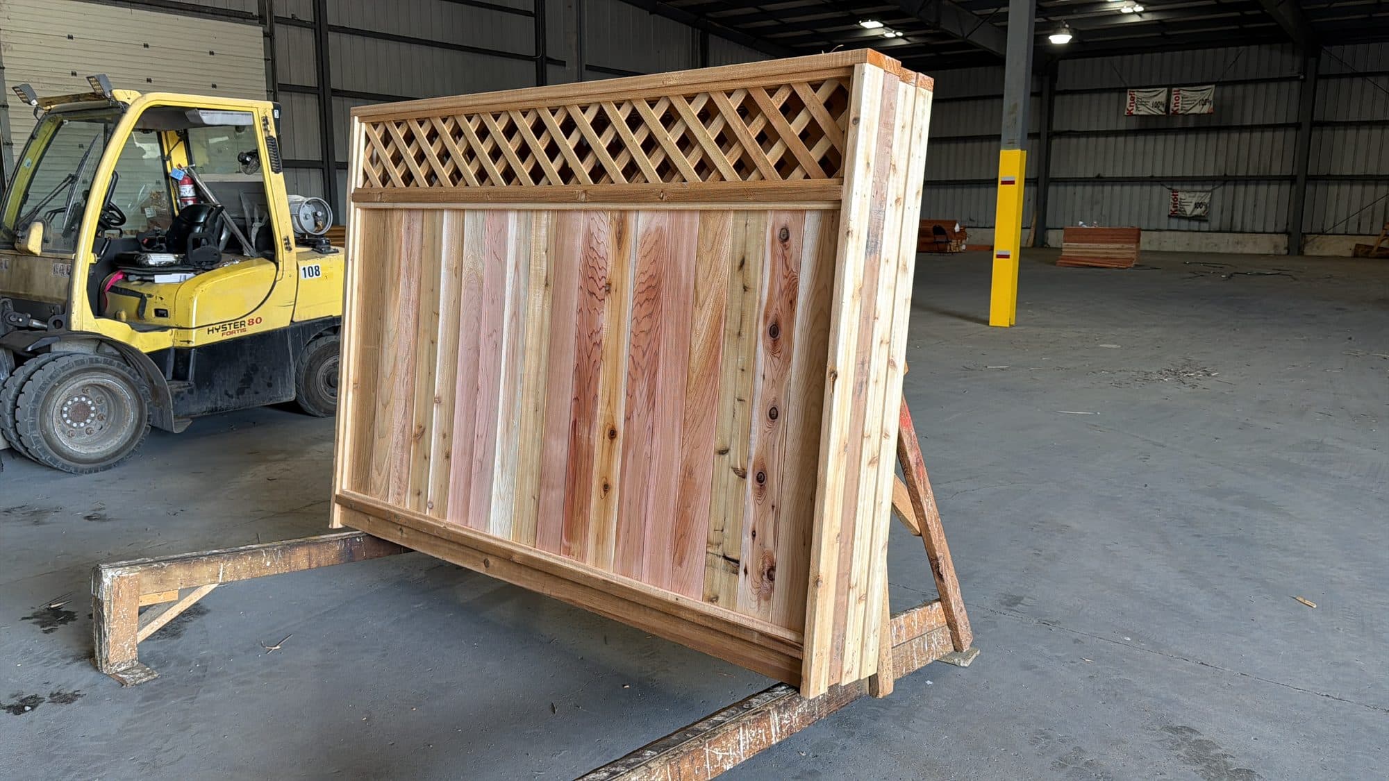 Cedar diagonal-lattice fence panels banded and staged at the NorthStar facility in Bolton, Ontario